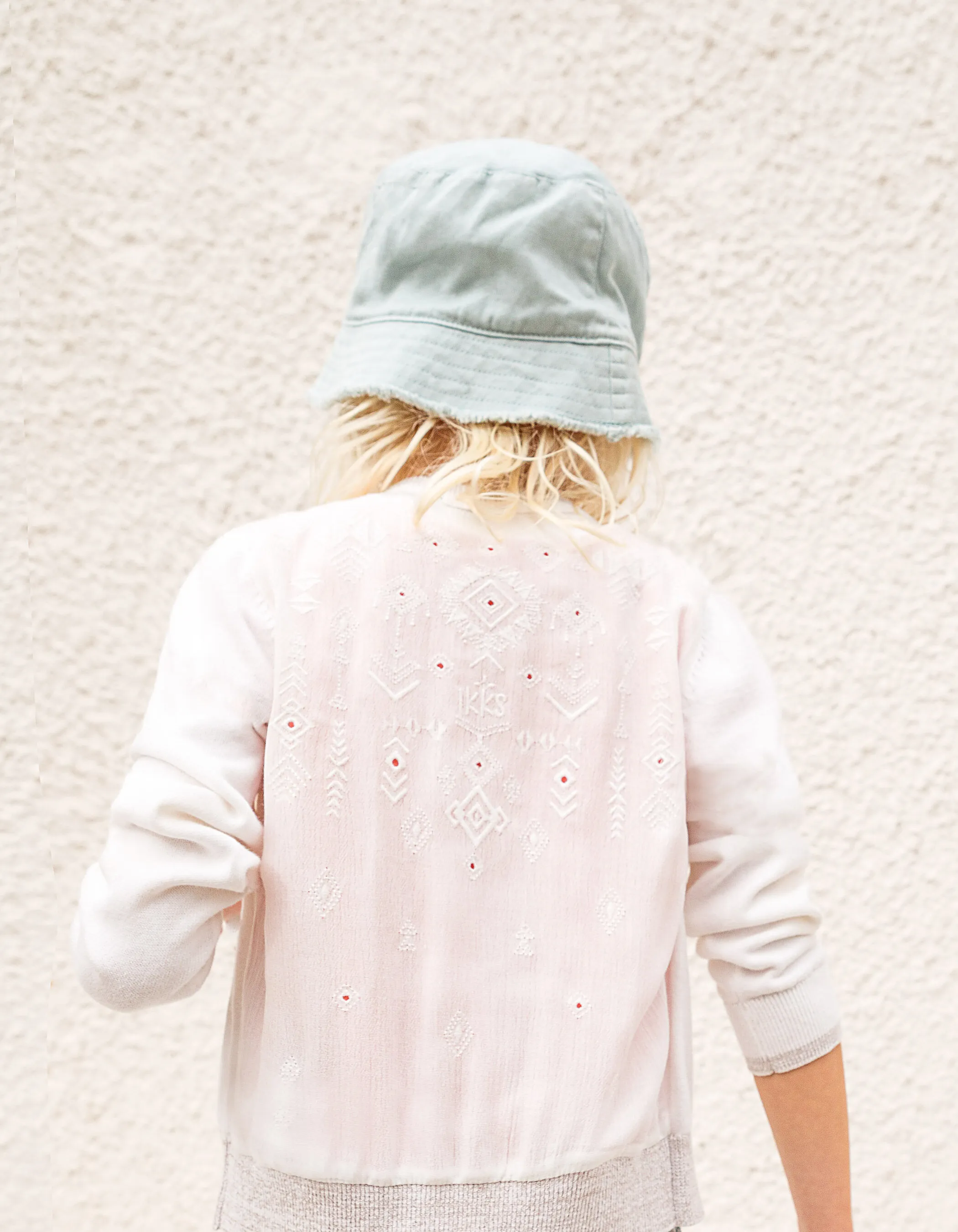 White broken cardigan embroidered back girl.