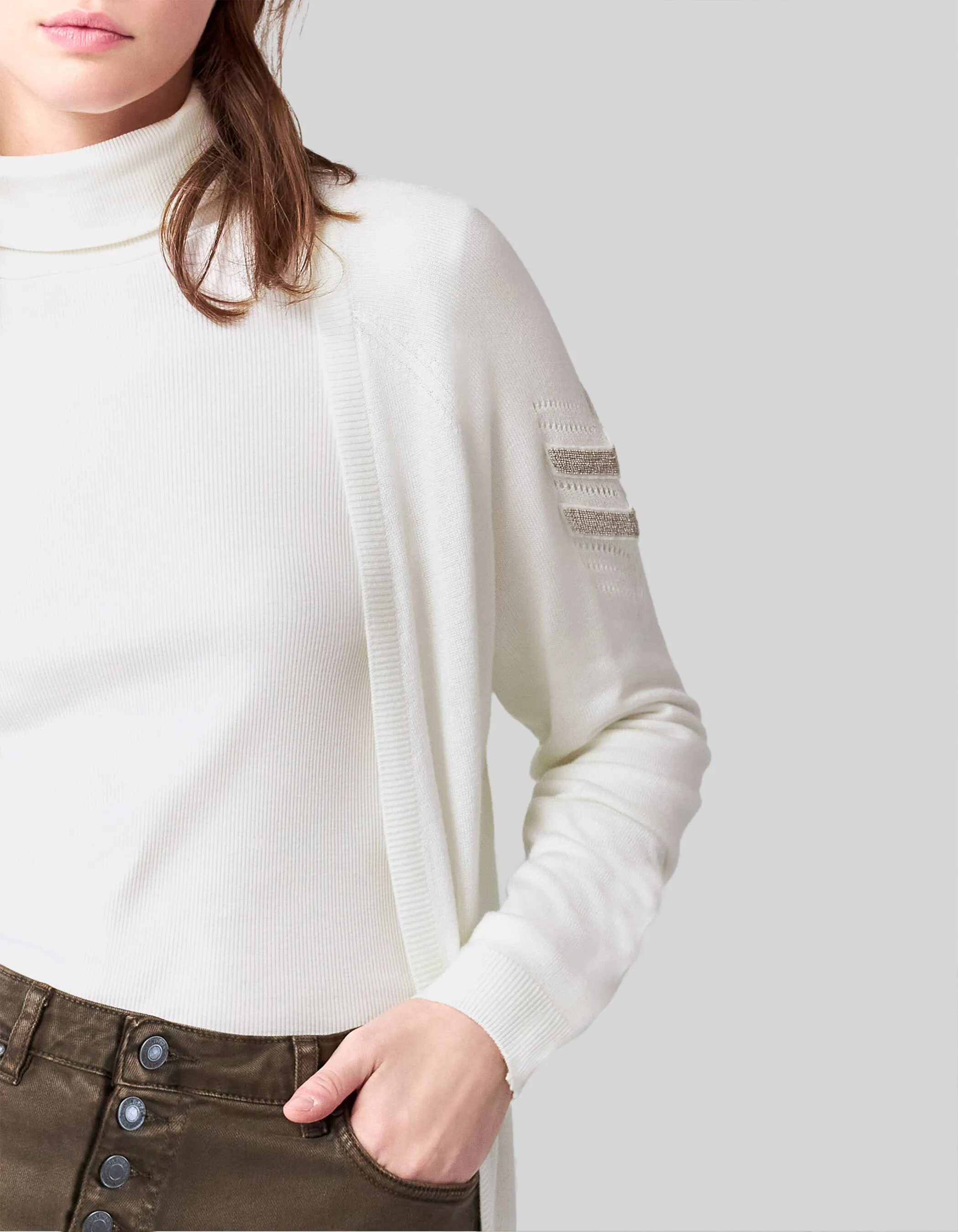 Off-white knit cardigan with embroidered chevron pattern for women.