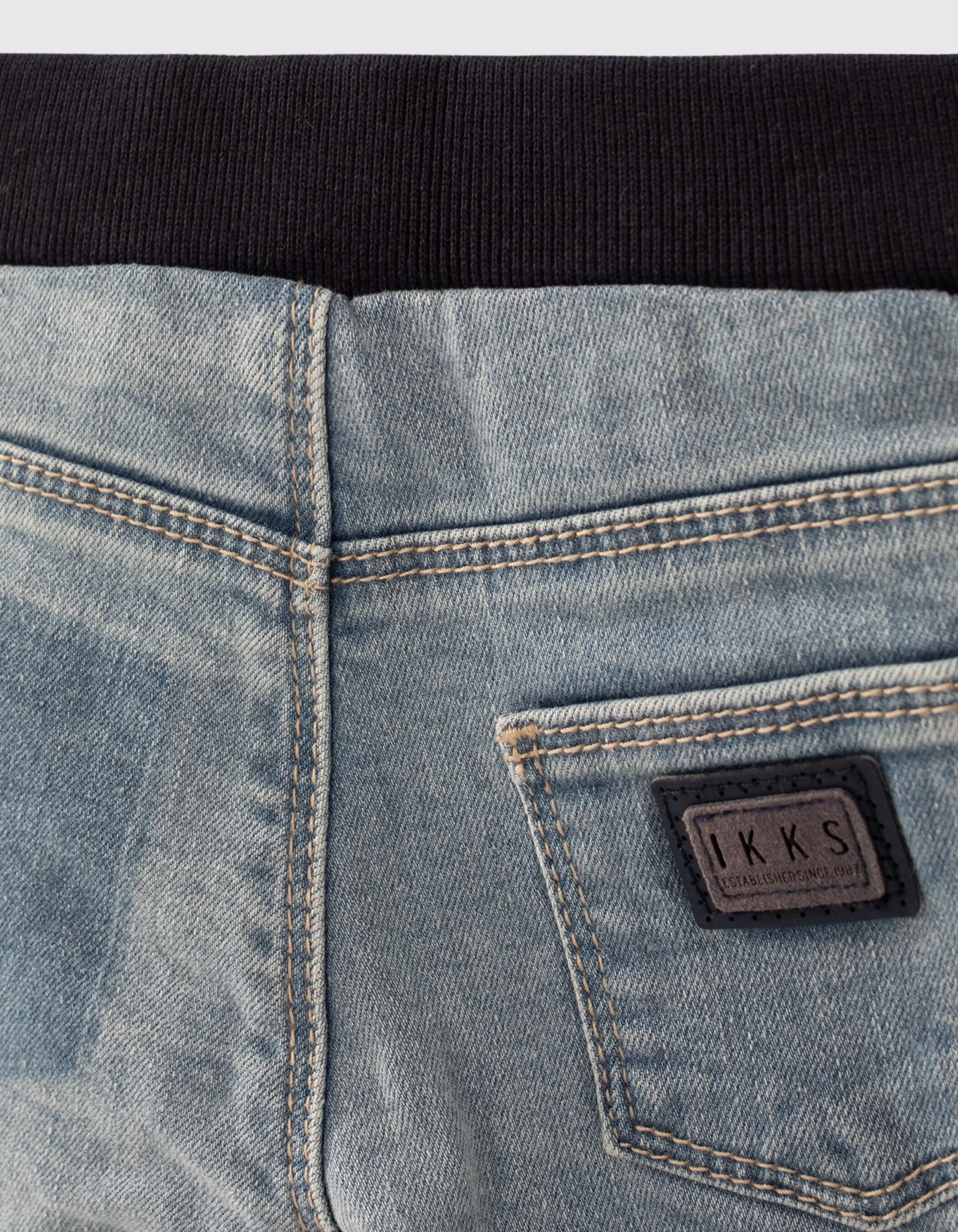 Blue jeans with print and baby boy badge