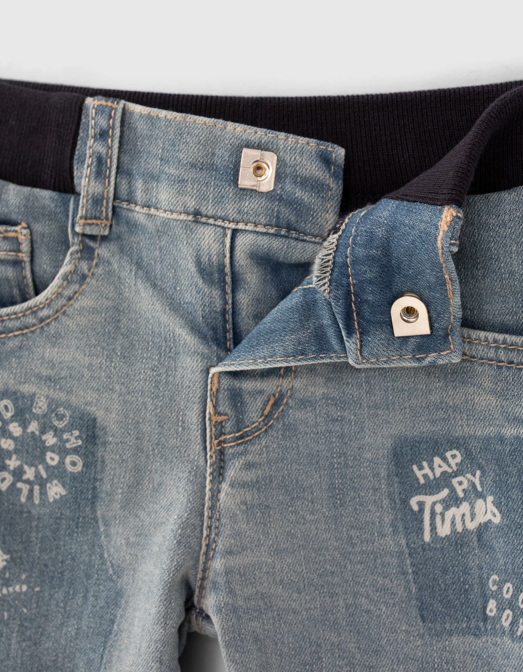 Blue jeans with print and baby boy badge